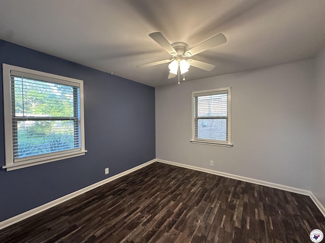 3706 Greenwood St, Texarkana, AR 71854 - spare room featuring dark wood-style flooring, baseboards, and a ceiling fan