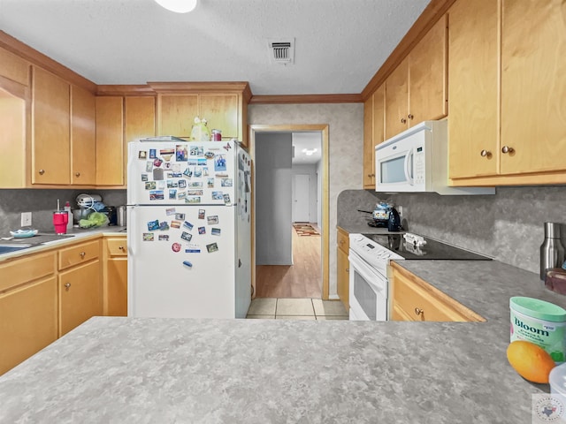 kitchen featuring white appliances, visible vents, ornamental molding, a textured ceiling, and light tile patterned flooring