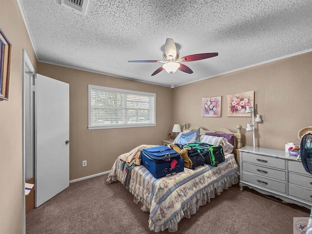 carpeted bedroom featuring a textured ceiling, visible vents, and a ceiling fan