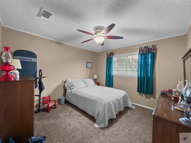 bedroom with carpet floors, a textured ceiling, visible vents, and a ceiling fan