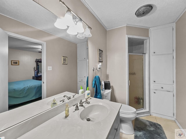 full bath featuring a textured ceiling, tile patterned flooring, toilet, vanity, and a stall shower