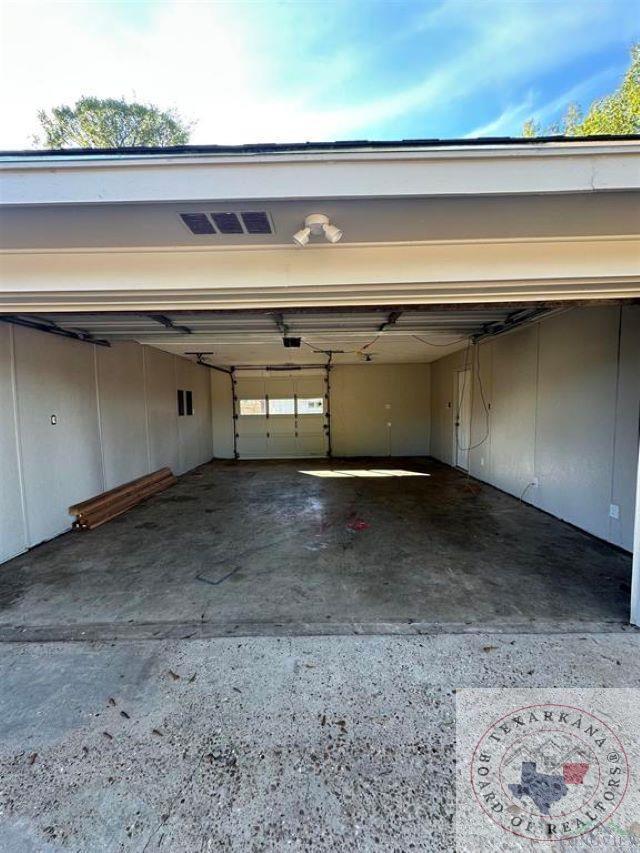 garage featuring a carport