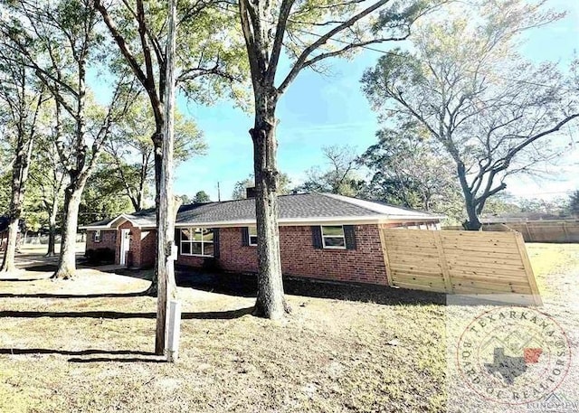 view of property exterior featuring a yard