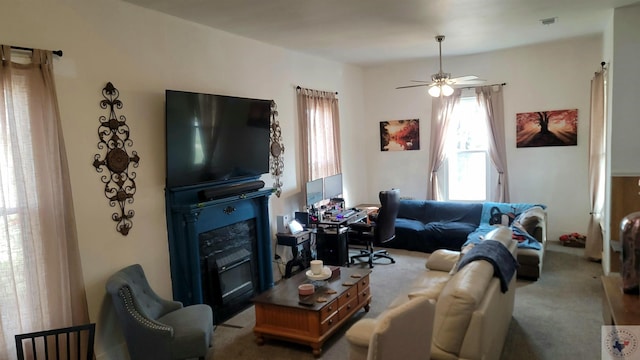 carpeted living room featuring ceiling fan