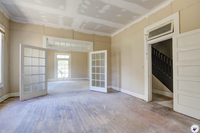 2101 Hazel St, Texarkana, TX 75501 - spare room with french doors and hardwood / wood-style flooring