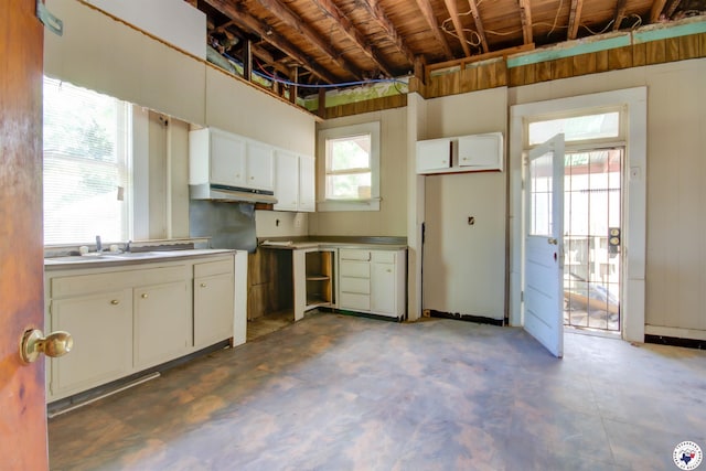 2101 Hazel St, Texarkana, TX 75501 - kitchen with white cabinets and concrete flooring