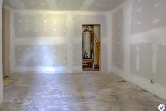 2101 Hazel St, Texarkana, TX 75501 - spare room with water heater and light wood-style flooring