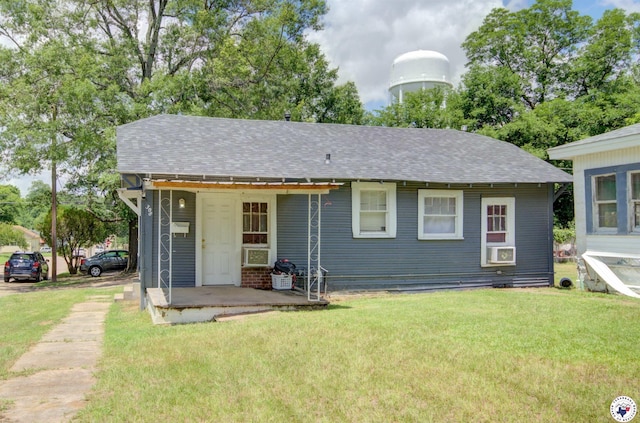 2101 Hazel St, Texarkana, TX 75501 - view of front facade with a front yard and a shingled roof