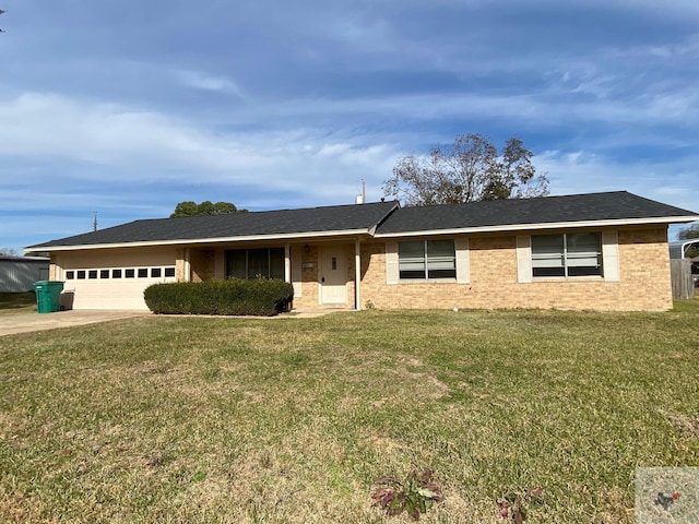 ranch-style house featuring a garage and a front yard