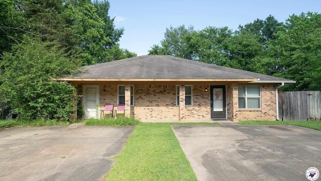 38023804 Grand, Texarkana, AR 71854 - view of front of house featuring covered porch, brick siding, and a shingled roof