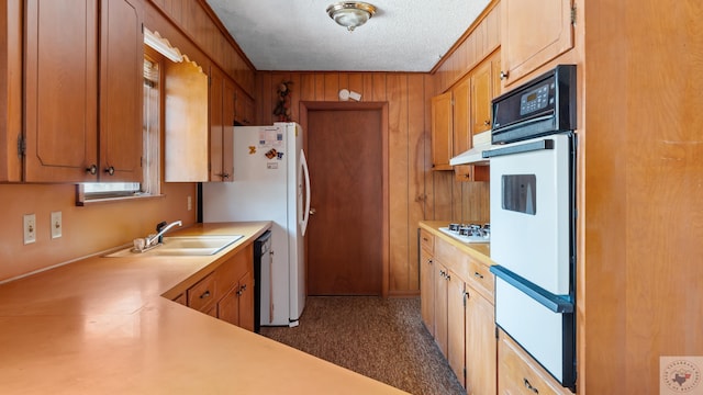 911 S Crestview Dr, Atlanta, TX 75551 - kitchen with white appliances, a sink, light countertops, under cabinet range hood, and a warming drawer