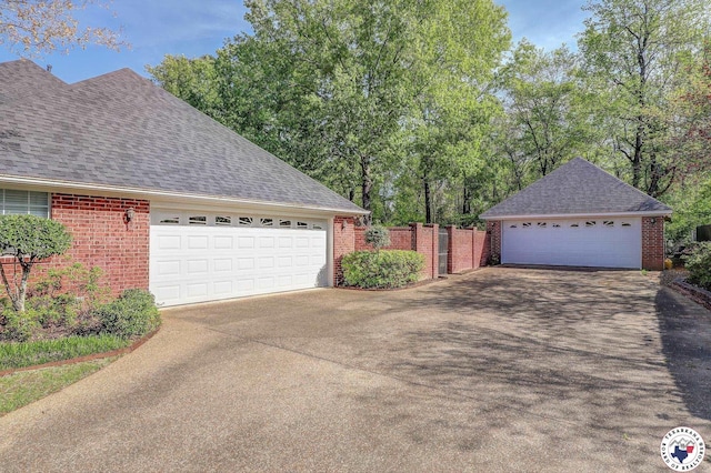 6632 Lakeridge Dr, Texarkana, TX 75503 - view of side of property with brick siding, roof with shingles, and fence