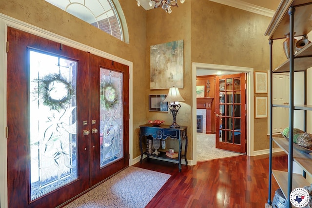 6632 Lakeridge Dr, Texarkana, TX 75503 - foyer entrance featuring french doors, wood finished floors, baseboards, crown molding, and a high ceiling