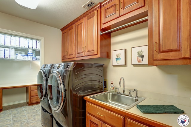 6632 Lakeridge Dr, Texarkana, TX 75503 - laundry room with independent washer and dryer, cabinet space, an office area, and a textured ceiling