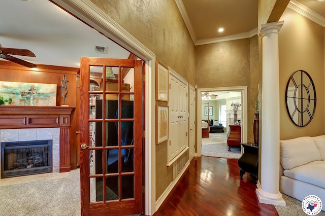 6632 Lakeridge Dr, Texarkana, TX 75503 - hall featuring ornate columns, crown molding, dark wood-type flooring, and baseboards