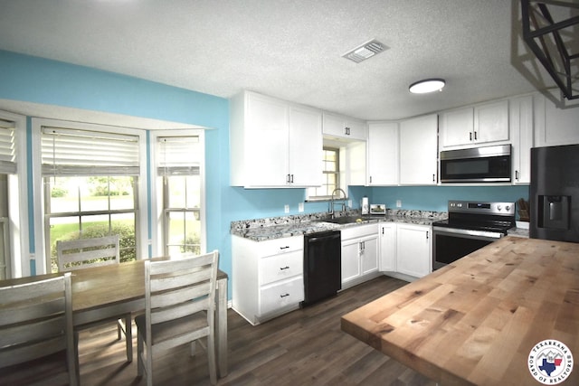 408 Village Ln, Wake Village, TX 75501 - kitchen featuring black appliances, wood counters, white cabinets, dark wood finished floors, and a textured ceiling