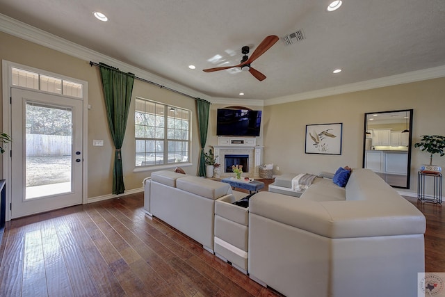 living room with ornamental molding, ceiling fan, and hardwood / wood-style floors