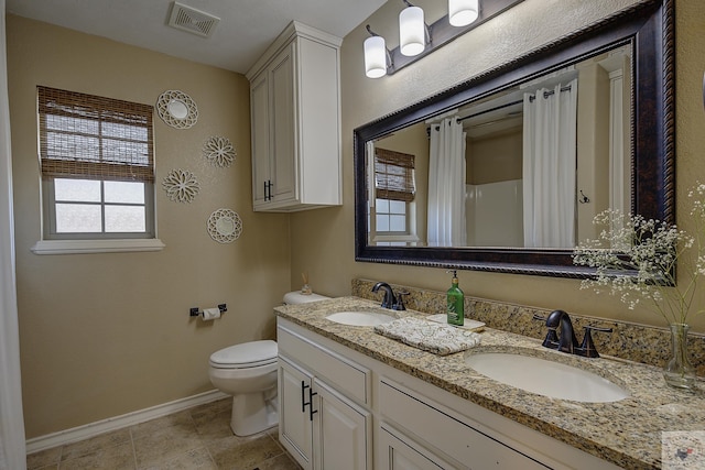 bathroom featuring a shower with curtain, toilet, tile patterned flooring, and vanity