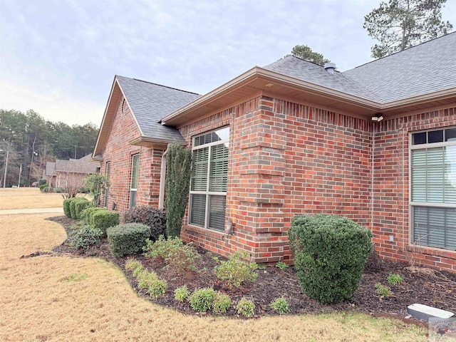 view of home's exterior with a lawn