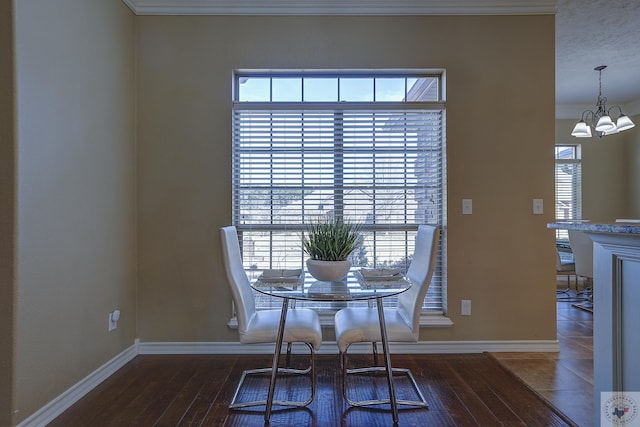 unfurnished dining area featuring an inviting chandelier, hardwood / wood-style floors, and crown molding