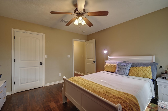 bedroom featuring ceiling fan and dark hardwood / wood-style floors