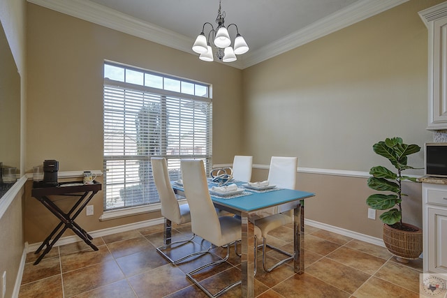 tiled dining room with a notable chandelier and ornamental molding