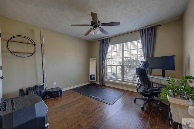 office featuring ceiling fan, a textured ceiling, and dark hardwood / wood-style floors