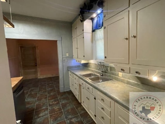 kitchen with sink and white cabinets