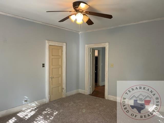 interior space with ceiling fan, carpet flooring, and ornamental molding