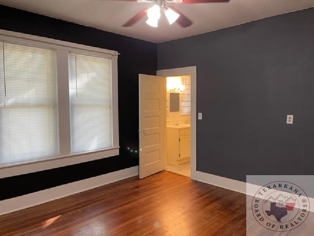 empty room featuring ceiling fan and hardwood / wood-style floors