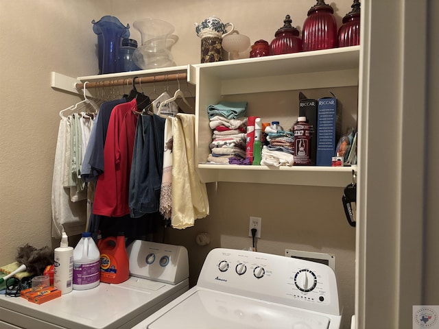 laundry room with washing machine and clothes dryer