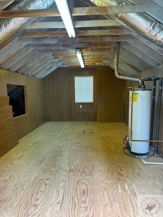 unfinished attic with gas water heater