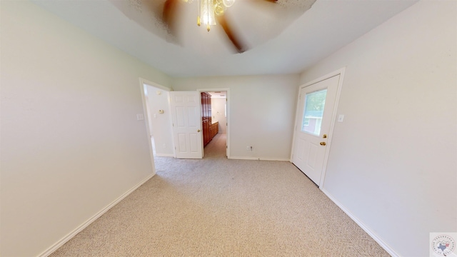 unfurnished room featuring ceiling fan and light carpet