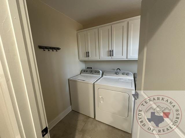 33 Timberlane St, Texarkana, TX 75501 - laundry room with washing machine and dryer, light tile patterned flooring, cabinet space, and baseboards