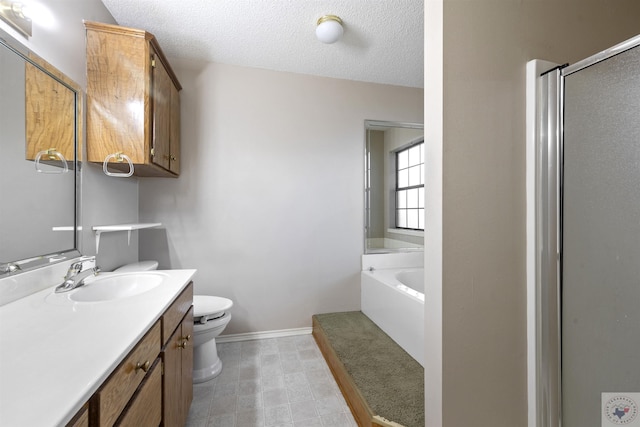 full bathroom featuring toilet, independent shower and bath, a textured ceiling, and vanity