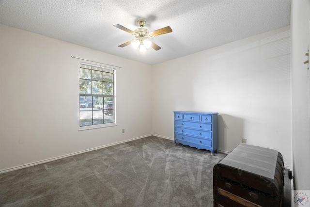 carpeted bedroom featuring a textured ceiling and ceiling fan