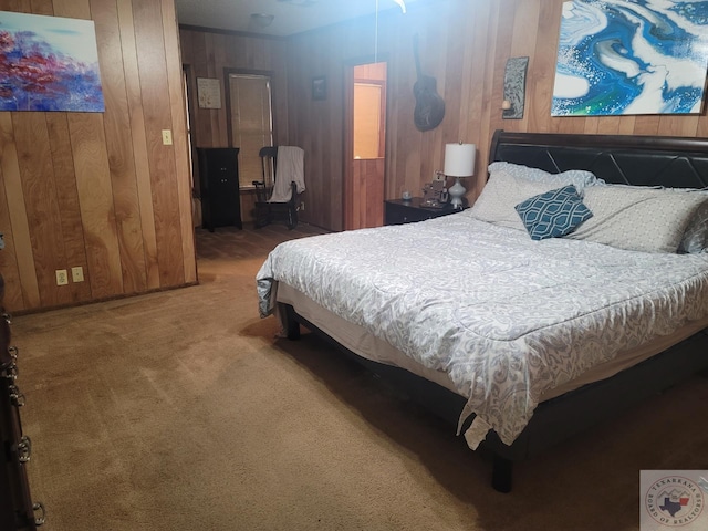 bedroom featuring carpet flooring and wooden walls