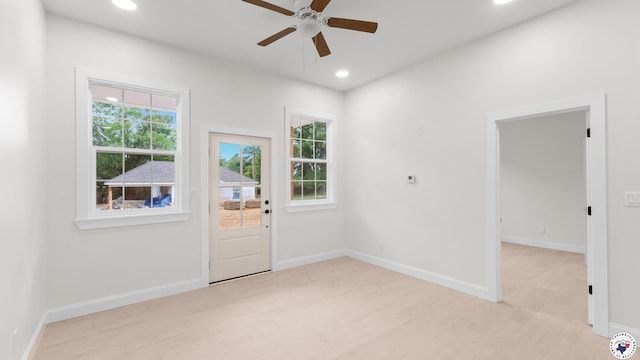 doorway to outside with recessed lighting, light wood-style floors, a ceiling fan, and baseboards
