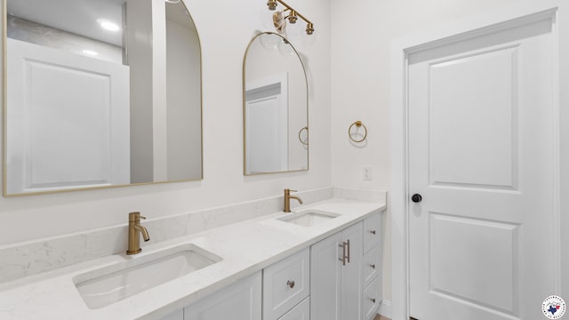 full bath featuring a sink and double vanity