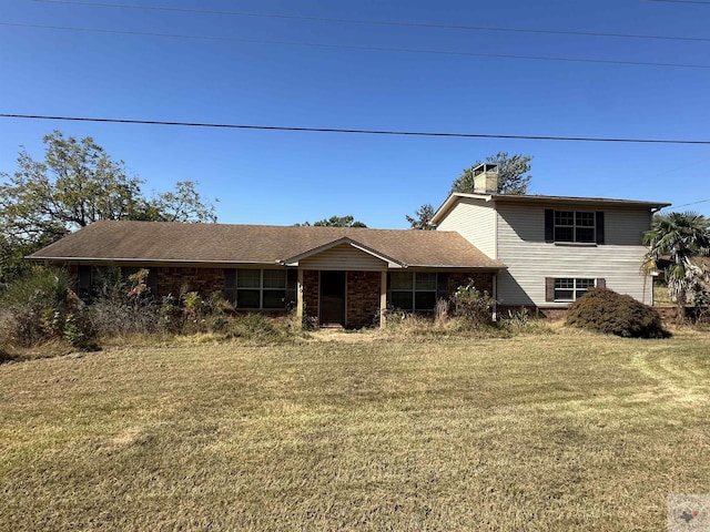 view of front of home with a front lawn