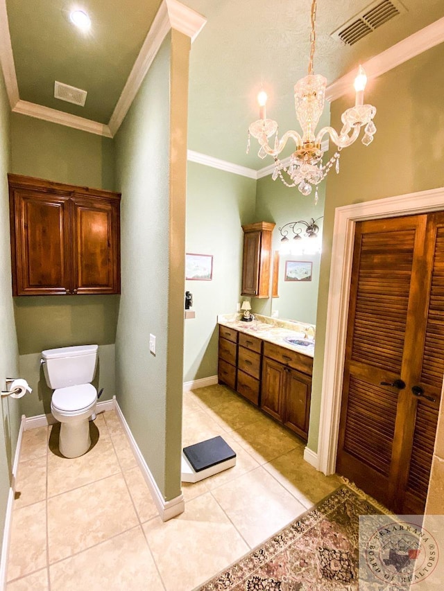 bathroom with tile patterned flooring, visible vents, crown molding, and a sink