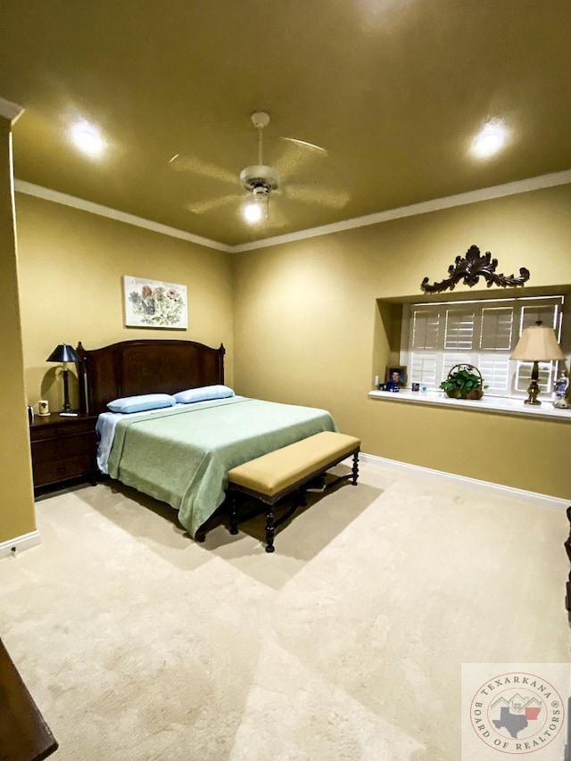 bedroom with a ceiling fan, baseboards, crown molding, and carpet flooring