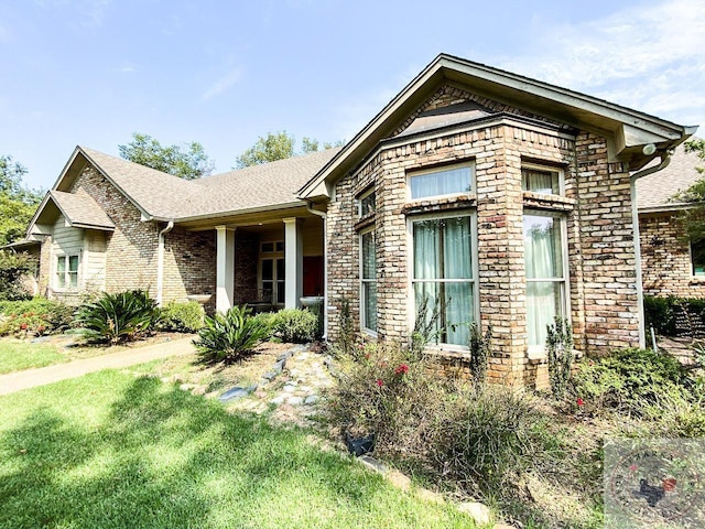 view of front of house with brick siding