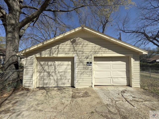 1302 Hickory St, Texarkana, AR 71854 - detached garage featuring driveway and fence
