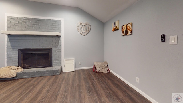 living room with a fireplace, lofted ceiling, and dark hardwood / wood-style flooring