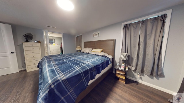 bedroom featuring dark wood-type flooring