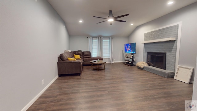 living room with a fireplace, lofted ceiling, ceiling fan, and dark hardwood / wood-style flooring