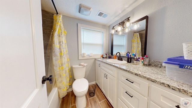 full bathroom with vanity, toilet, and shower / bathtub combination with curtain