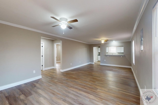 unfurnished living room featuring baseboards, crown molding, a ceiling fan, and wood finished floors