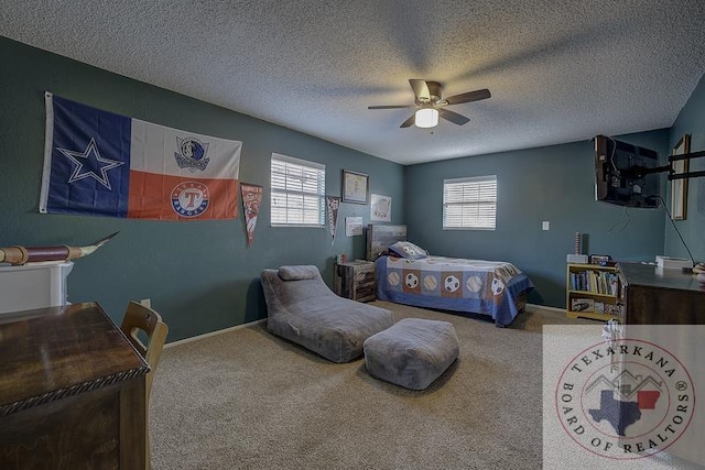 carpeted bedroom featuring ceiling fan, a textured ceiling, and multiple windows